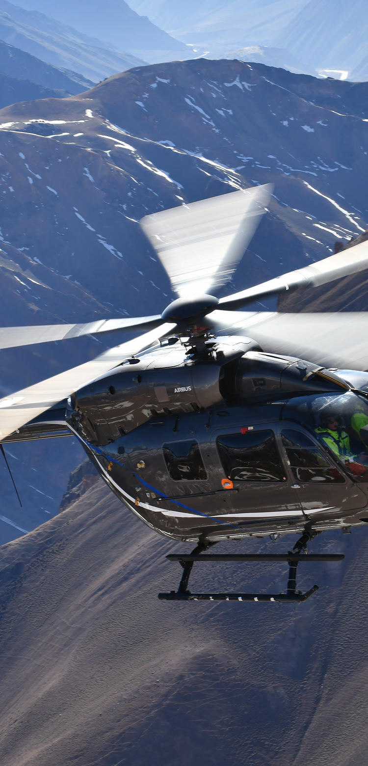 H145 Five Bladed Five bladed H145 flying over mountains